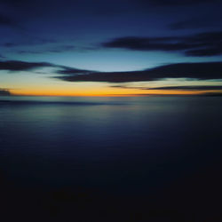 Scenic view of sea against dramatic sky