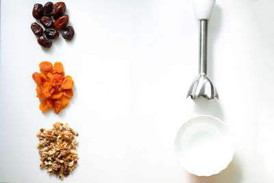 High angle view of breakfast on table against white background