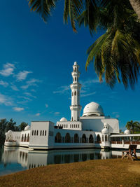 The view of a white floating mosque in kuala ibai, terengganu, malaysia.