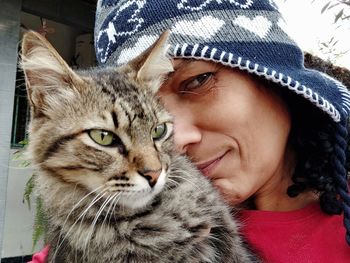 Portrait of woman with cat