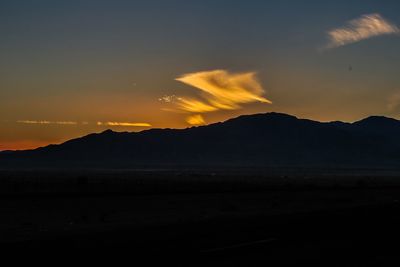 Scenic view of mountains at sunset