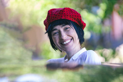 Portrait of young woman wearing hat