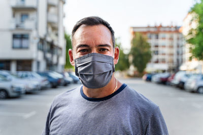 Portrait of man in city street