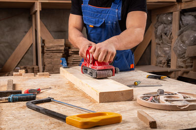 Midsection of man preparing food on table