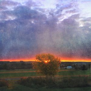 Scenic view of landscape against cloudy sky