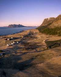 Scenic view of beach against sky during sunset