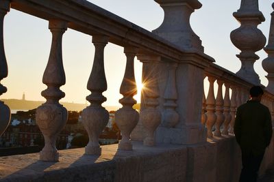 Statue in temple at sunset