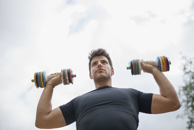 Low angle view of man exercising outdoors