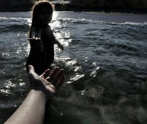 Woman standing on beach