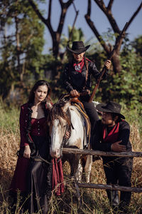 Portrait of a thai woman and her horse-riding acquaintance in thailand's forest, a portrait