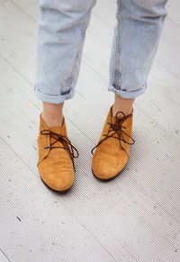 Woman legs in brown shoes