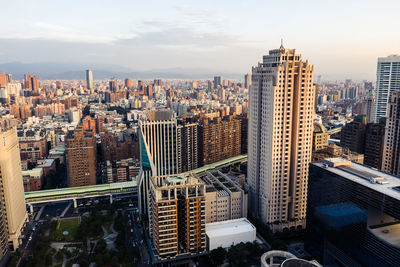 High angle view of buildings in city against sky