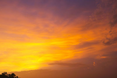 Low angle view of dramatic sky during sunset