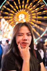 Portrait of young woman at amusement park