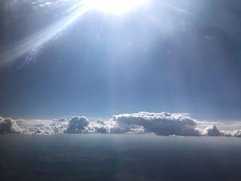 Scenic view of mountains against bright sun