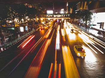 High angle view of light trails on road at night