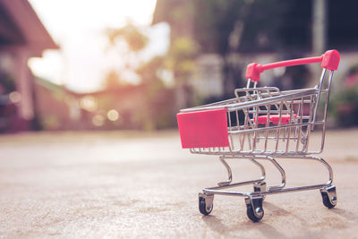 Close-up of empty miniature shopping cart