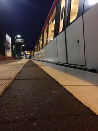 Train at railroad station against sky at night