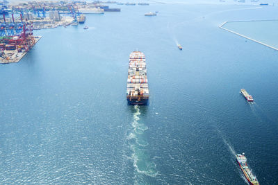 Aerial view of container ship sailing on sea