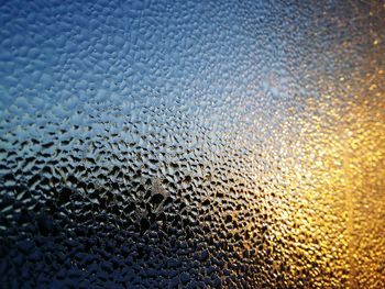 Full frame shot of wet window in rainy season