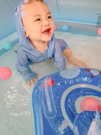 High angle view of smiling boy in water