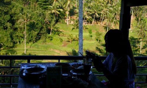 Woman with food sitting at table