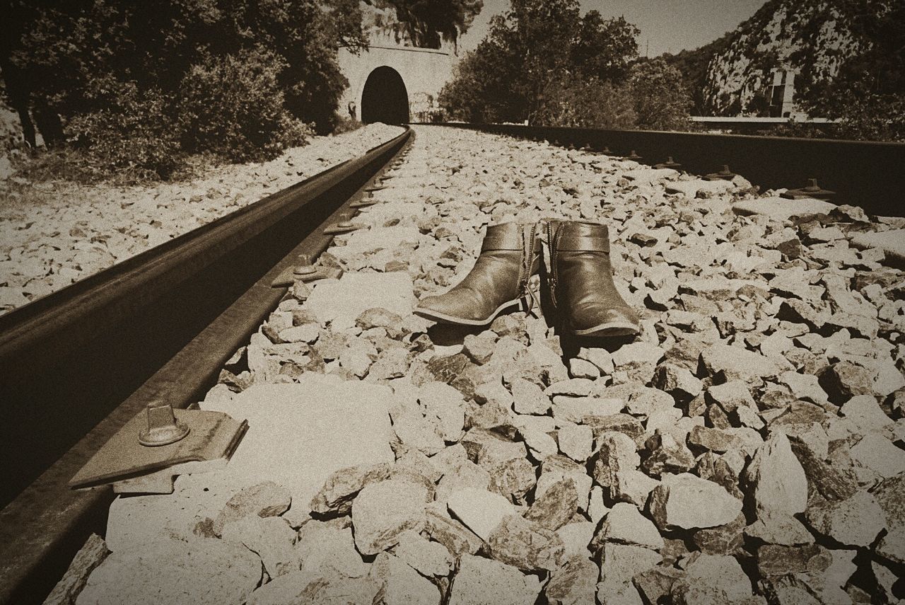 LOW SECTION OF RAILROAD TRACK ON ROCK