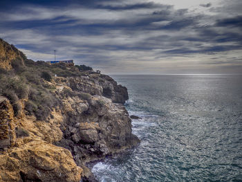 Scenic view of sea against cloudy sky