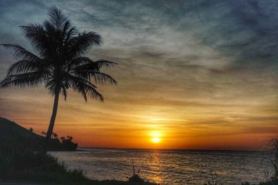 Scenic view of sea against sky at sunset