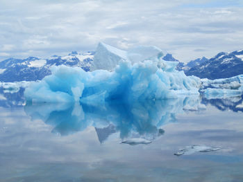 Scenic view of iceberg in frozen sea