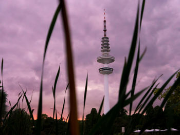 Low angle view of tower against sky during sunset