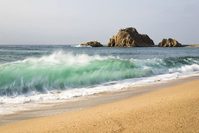 Scenic view of sea against clear sky