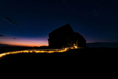 Built structure against sky at night