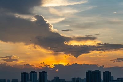 Cityscape against sky during sunset