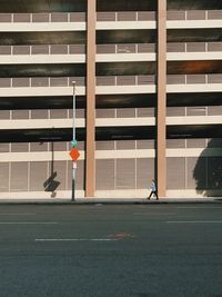 Man playing with building in background