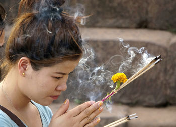 Close-up of young woman in water