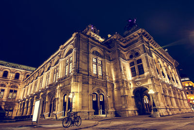 Low angle view of illuminated building at night