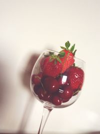 Close-up of strawberry over white background