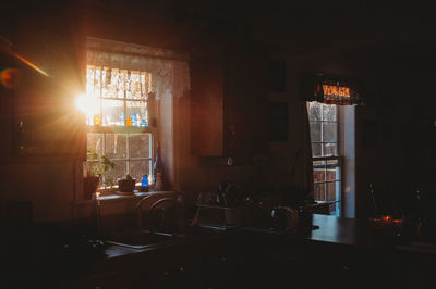 Illuminated restaurant by window at home