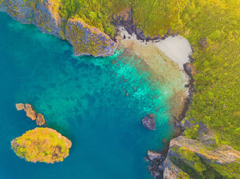 High angle view of rock formation by sea