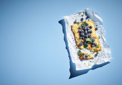 High angle view of ice cream against blue background