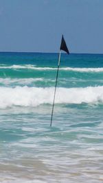 Scenic view of sea against blue sky