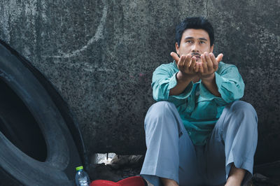 Portrait of a young man drinking food