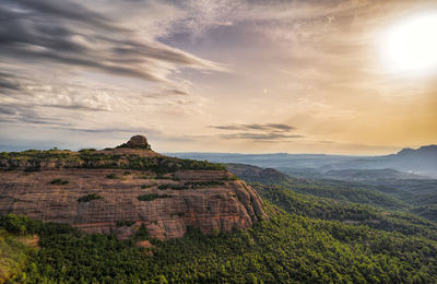 Scenic view of landscape against sky during sunset