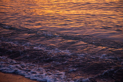 High angle view of sea shore during sunset