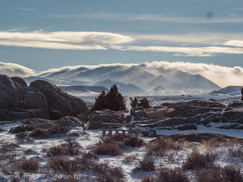 Scenic view of landscape against sky during winter