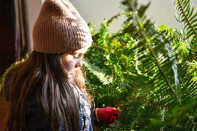 Close-up of girl with tree