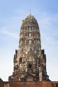 An ancient pagoda in an old temple and a very old brick wall in ayutthaya, thailand.