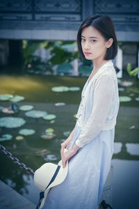 Portrait of woman standing outdoors