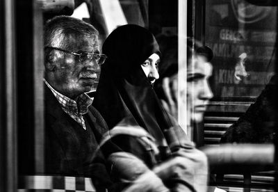 Reflection of man on glass window